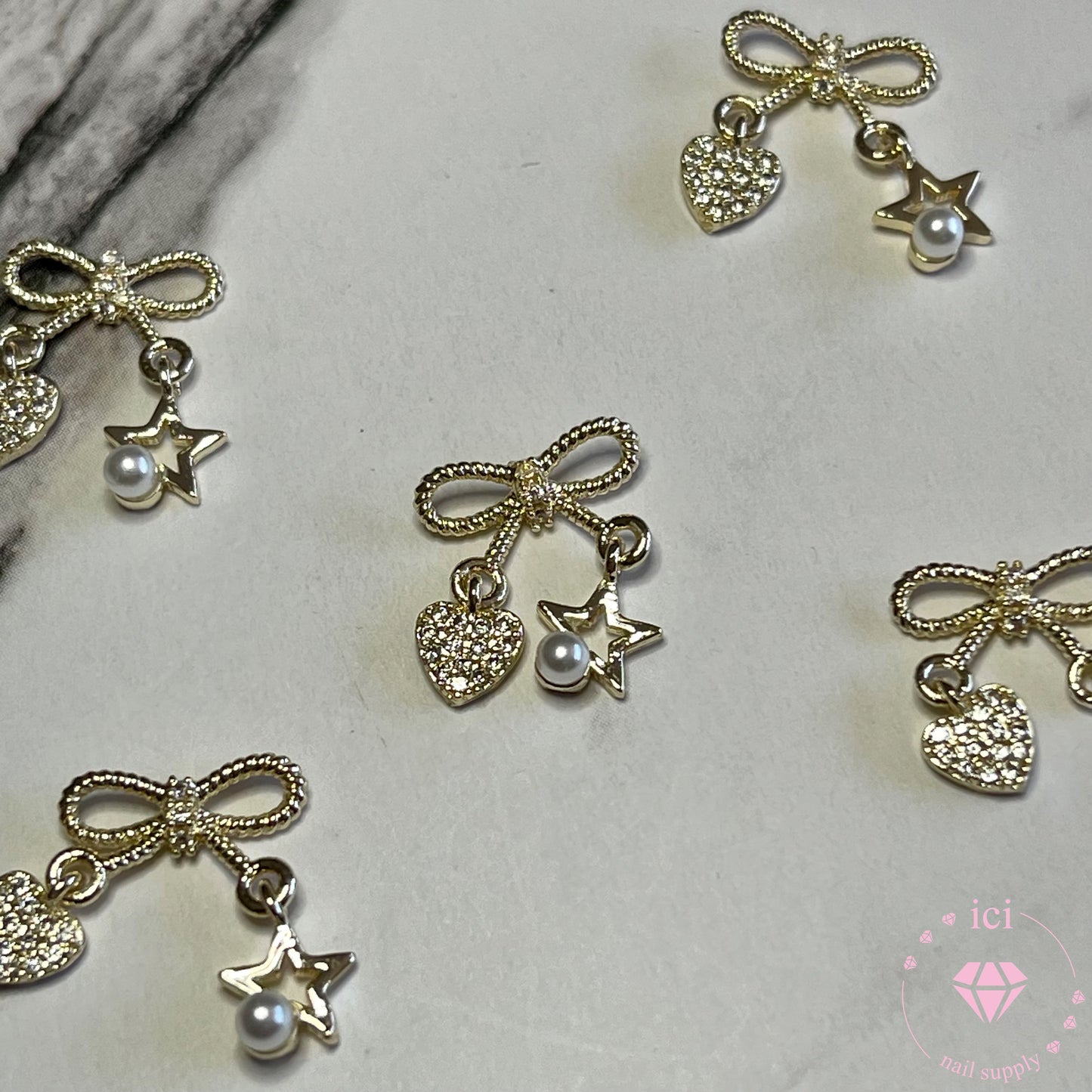 Bow with Heart and Star Pearl Dangle